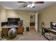 Bedroom featuring neutral walls, ceiling fan, standard closet and small desk at 506 Glen Ivy # 5, Marietta, GA 30062