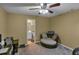 Bedroom featuring neutral walls, ceiling fan, and sitting chair at 506 Glen Ivy # 5, Marietta, GA 30062