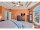 Spacious bedroom featuring a tray ceiling with fan, natural light and stylish furniture at 506 Glen Ivy # 5, Marietta, GA 30062