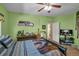 Spacious bedroom with ample natural light, sports decor, and ceiling fan at 506 Glen Ivy # 5, Marietta, GA 30062