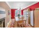 Charming dining room with a window view, chandelier, and hardwood flooring at 506 Glen Ivy # 5, Marietta, GA 30062