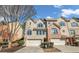 Inviting townhouse with a two-car garage, a combination of brick and siding, and a neatly manicured front yard at 506 Glen Ivy # 5, Marietta, GA 30062
