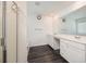 Bright bathroom with double sinks, white cabinets, and large mirror, offering a clean, modern design at 668 Isom Walk, Suwanee, GA 30024