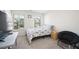Cozy bedroom with a window view, bed, and chair offering a comfortable, relaxing atmosphere at 668 Isom Walk, Suwanee, GA 30024