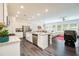 Spacious kitchen with stainless steel appliances, granite countertops, and a large central island at 668 Isom Walk, Suwanee, GA 30024
