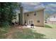 Expansive backyard featuring a patio area, lush lawn, and mature trees, ideal for outdoor activities at 1000 Willow Crest Lndg, Austell, GA 30168