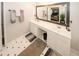 Bright bathroom featuring a double sink vanity and a decorative mirror showcasing the connected bedroom at 1000 Willow Crest Lndg, Austell, GA 30168