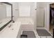 Bright bathroom with a vanity sink, a large bathtub, and a separate glass shower at 1000 Willow Crest Lndg, Austell, GA 30168