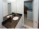 Bathroom featuring dual sinks, a granite countertop, and neutral decor at 1000 Willow Crest Lndg, Austell, GA 30168