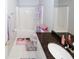 Bathroom area featuring a granite vanity and shower with purple themed decor at 1000 Willow Crest Lndg, Austell, GA 30168