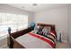 Cozy bedroom featuring natural light and neutral colors with a wooden dresser at 1000 Willow Crest Lndg, Austell, GA 30168