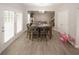 Bright dining area with a large table, ample seating, and open access to the living room at 1000 Willow Crest Lndg, Austell, GA 30168