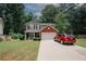 Beautiful two-story home with a manicured lawn, brick facade, and attached two-car garage at 1000 Willow Crest Lndg, Austell, GA 30168