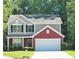 Charming two-story home with a well-manicured lawn and an attached two-car garage at 1000 Willow Crest Lndg, Austell, GA 30168