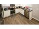 Modern kitchen features white cabinets, stainless steel appliances, and durable countertops at 1000 Willow Crest Lndg, Austell, GA 30168