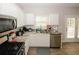 Modern kitchen with white cabinets, stainless steel appliances, and ample counter space at 1000 Willow Crest Lndg, Austell, GA 30168