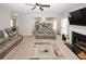 Spacious living room with a fireplace, comfortable seating, and an open layout to the kitchen at 1000 Willow Crest Lndg, Austell, GA 30168