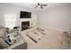 Comfortable living room features plush seating, fireplace, ceiling fan, and neutral color palette at 1000 Willow Crest Lndg, Austell, GA 30168