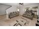 Open concept living room with carpet, sofas and a glimpse into the modern kitchen at 1000 Willow Crest Lndg, Austell, GA 30168