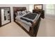 Elegant bedroom with a dark wood bed frame and furniture at 1000 Willow Crest Lndg, Austell, GA 30168