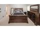 Spacious main bedroom featuring a large, dark wood bedroom set and plenty of natural light at 1000 Willow Crest Lndg, Austell, GA 30168