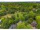 Lush green canopy surrounds homes in this aerial view showcasing a tranquil community at 1020 Austin Ne Ave, Atlanta, GA 30307