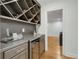 Stylish bar area with a wine rack, countertop, and a mini refrigerator for entertaining at 1020 Austin Ne Ave, Atlanta, GA 30307