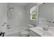 Bright bathroom features a shower-over-tub combination with a window to let in natural light at 1020 Austin Ne Ave, Atlanta, GA 30307