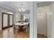 An elegant dining room features a wooden table, upholstered chairs, and french doors to outside at 1020 Austin Ne Ave, Atlanta, GA 30307