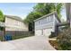 Backyard featuring a two car garage, basketball court, mature landscaping and a wooden fence at 1020 Austin Ne Ave, Atlanta, GA 30307