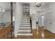 Elegant foyer with hardwood floors, staircase, and modern lighting, creating a grand entrance at 1020 Austin Ne Ave, Atlanta, GA 30307