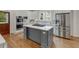Modern kitchen featuring stainless steel appliances, a center island, and ample counter space at 1020 Austin Ne Ave, Atlanta, GA 30307