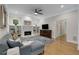 Bright living room with a fireplace, built-in shelves, and a plush couch at 1020 Austin Ne Ave, Atlanta, GA 30307