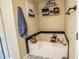 Cozy bathroom featuring a relaxing soaking tub with black tiled trim at 1565 Wynfield Dr, Auburn, GA 30011