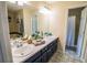 Bright bathroom with double sinks, ample counter space, and decorative tile flooring at 1565 Wynfield Dr, Auburn, GA 30011
