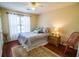 Bright bedroom with hardwood floors, natural light, and coordinated furnishings at 1565 Wynfield Dr, Auburn, GA 30011