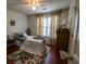 Comfortable bedroom with a queen-size bed, ceiling fan and inviting décor at 1565 Wynfield Dr, Auburn, GA 30011