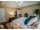 Relaxing bedroom featuring a ceiling fan, closet, rocking chair, and bedside table at 1565 Wynfield Dr, Auburn, GA 30011