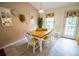 Cozy dining area features a wooden table with seating for four, with stylish decor at 1565 Wynfield Dr, Auburn, GA 30011