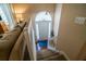 View of the staircase, front door with transom window, and railing at 1565 Wynfield Dr, Auburn, GA 30011