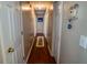 Inviting hallway with hardwood floors and neutral paint, creating a welcoming atmosphere at 1565 Wynfield Dr, Auburn, GA 30011
