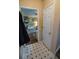 Hallway with tiled floors leading to the living area with neutral colors and design at 1565 Wynfield Dr, Auburn, GA 30011
