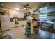 Charming open-concept kitchen featuring white cabinets and a cozy breakfast bar leading to bedroom at 1565 Wynfield Dr, Auburn, GA 30011