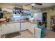 Bright kitchen showcases white cabinetry, tile countertops, and ample storage space at 1565 Wynfield Dr, Auburn, GA 30011