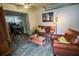 Comfortable living area with leather furniture and a vibrant art piece providing a welcoming atmosphere at 1565 Wynfield Dr, Auburn, GA 30011