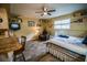 Spacious living room featuring a kitchenette, TV, seating, and a comfortable bed at 1565 Wynfield Dr, Auburn, GA 30011