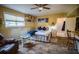 Bright living room featuring a seating area, kitchenette, and natural light at 1565 Wynfield Dr, Auburn, GA 30011