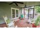 Charming screened porch featuring rocking chairs and ample space for outdoor relaxation at 1565 Wynfield Dr, Auburn, GA 30011