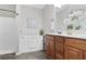 Modern bathroom featuring a soaking tub, walk-in shower, and vanity with dark wood cabinetry at 161 Overlook Cir, Canton, GA 30115