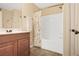 Well-lit bathroom with a shower-tub combo, vanity, and neutral-toned decor at 161 Overlook Cir, Canton, GA 30115